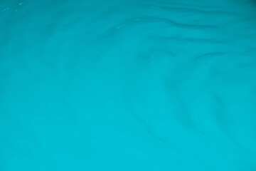 Fototapeta premium Blue liquid, waves, fluidity.