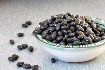 Detail of black beans in a porcelain bowl