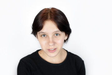 Portrait of a beautiful young teenage girl smiling and talking, she says encouraging words to herself, she needs support and understanding from others