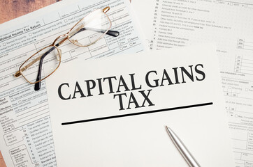 CAPITAL GAINS TAX, business concept image with soft focus background and vintage tone