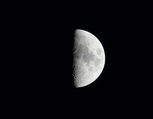 High quality photo of moon with craters on black night sky background. Astrophotography.