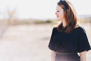 Woman in black outdoors 