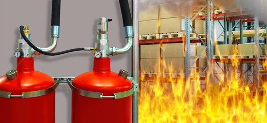 Fire inside warehouse. Fire extinguishers are fixed on wall. Red fire extinguishers close up....