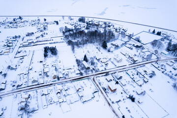 Top view of the winter panorama of the Vileysky reservoir and the village