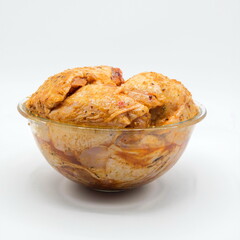Marinated chicken on white background