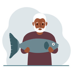 A old male fisherman holds a large fish, proud of good fishing or hunting. Hobby, fishing concept.