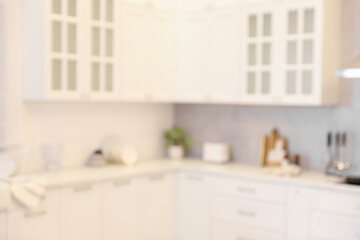 Fototapeta na wymiar Blurred view of modern kitchen. Interior design
