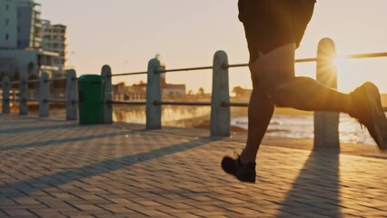 Man, beach and sunset running, exercise and cardio training with music for motivation, fitness mindset and marathon goals. Runner, athlete and guy workout at sea, nature and ocean for sports wellness