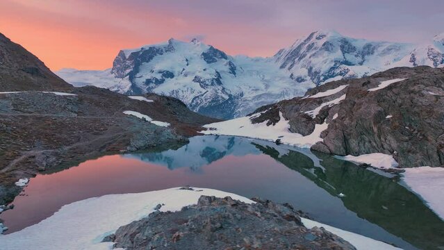 hiking in Swiss Alps, beautiful aerial view of snowy glacier in European Alps at sunrise ,the famous five lakes of Matterhorn and Gornergrat ridge