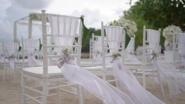 Wedding decoration to beach white sand for wedding set up.Decorated white patterns concept.	