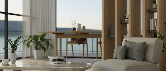 Luxury and cozy living room with balcony interior design with couch, coffee table, dining table