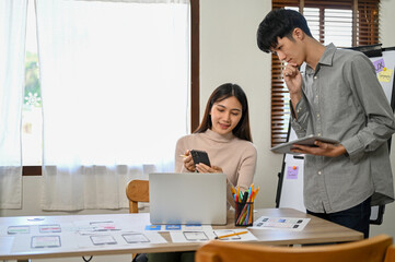 Professional Asian male and female developers are in the meeting room, working together