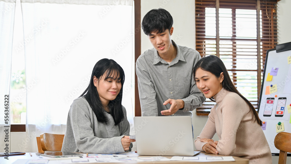 Poster group of millennial asian website and mobile application developers startup are in the meeting