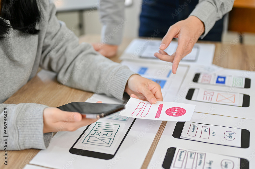 Canvas Prints cropped image, a team of mobile application interface designers are in the meeting
