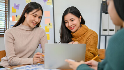 Smart millennials Asian UX developer and UI designer are in the meeting