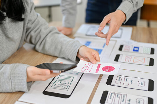 cropped image, A team of mobile application interface designers are in the meeting