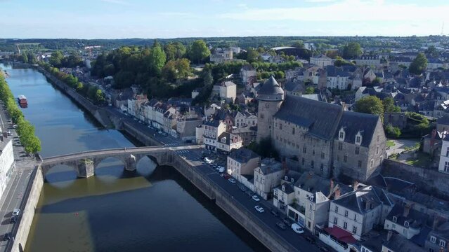 Laval Castle next River Mayenne, France, Tilt Down Ascending Aerial.