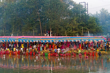 30.10.2022. Raiganj , West Bengal, India. chhat puja rituals and worship of god on the river bank...