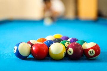Billiard balls on the blue table for the game