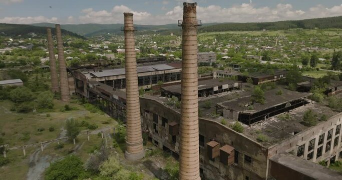 Abandoned Factory Brick Smokestack In Surami, Khashuri, Georgia. - aerial