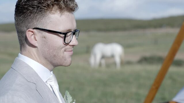Groom saying "I do" at outdoor backyard wedding ceremony. Fairytale wedding. Shot in 4K 60FPS for high quality slow motion. Purchase entire event raw at wholesale price email willneatheryyahoo.com.