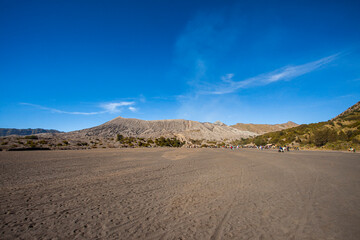 The view of Mount Bromo is seen from a very wide desert which is known as the whispering sand. One of the favorite tourist attractions in the Bromo-Tengger-Semeru area, in East Java, Indonesia.