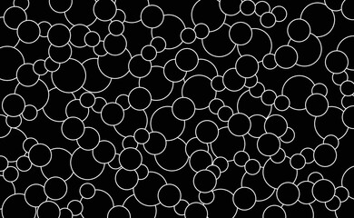 Many white circles on black background