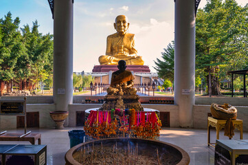 Ayutthaya, Thailand. 23 October, 2022   Big golden Luang Pu Thuat Statue at Maharat Buddhist Park in Phra Nakhon Si Ayutthaya province.