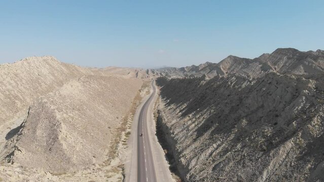 Aerial View Of Makran Coastal Highway Road Beside Dramatic Rock Formations In Hingol National Park. Pedestal Up
