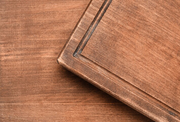 Closeup view of board on wooden background