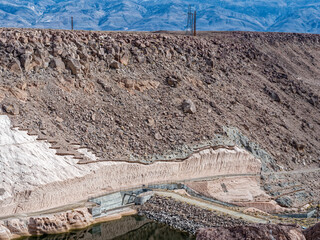 Cliffs line the edge of the Pleasant Valley Dam near Bishop, California, USA