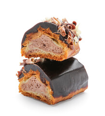 Pieces of sweet chocolate eclair on white background