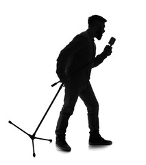 Silhouette of young man singing in microphone on white background