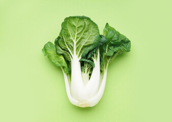 Fresh pak choi cabbage on green background - obrazy, fototapety, plakaty