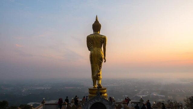 Time Lapse of The Golden buddha in sunrise. Aerial view sunrise at Wat Phra That Kao Noi in Nan Province , Thailand. Time Lapse Sunrise Buddha and Sea of Fog