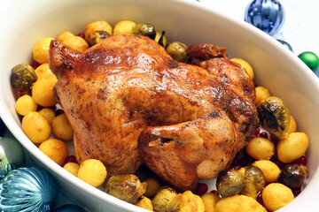 Baking dish with tasty Christmas chicken and vegetables, closeup