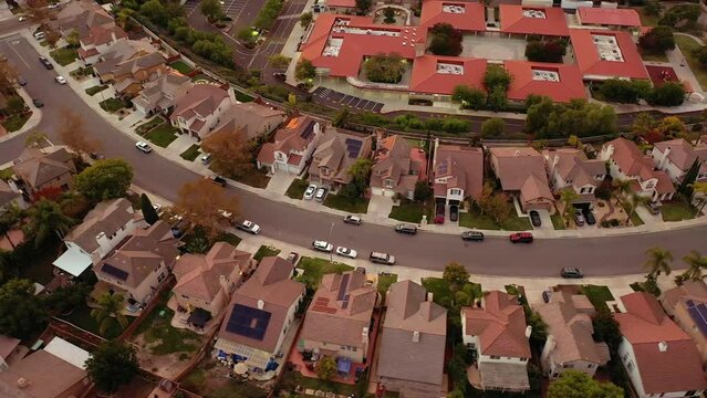 Aerial top view of upper middle class neighborhood with residential house next to each other in Chula Vista, California, USA.