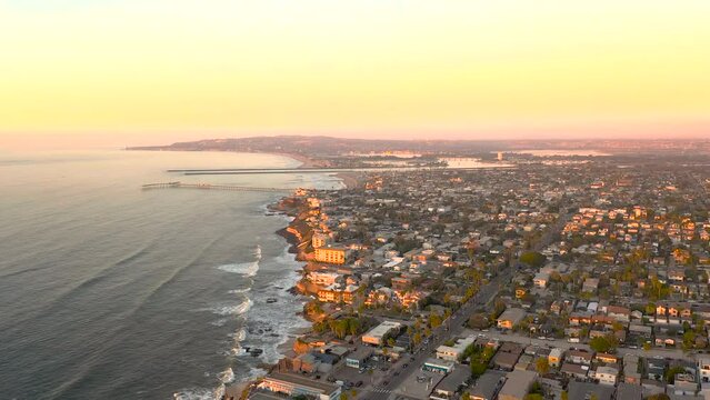 Ocean Beach, a community at the San Diego Coast, drone flight at sunset.