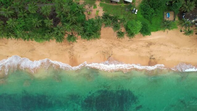 From above the waves break at Jale  beach, at  Sao Tome, Africa