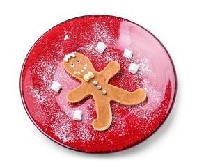 Plate with tasty Christmas pancake in shape of gingerbread man on white background