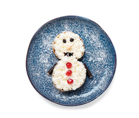 Plate with snowman made of pancakes and whipped cream on white background