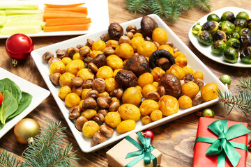 Tasty dishes for Christmas dinner on table