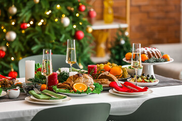 Different tasty dishes for Christmas dinner on table
