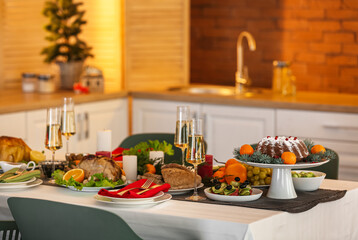 Different tasty dishes for Christmas dinner on table