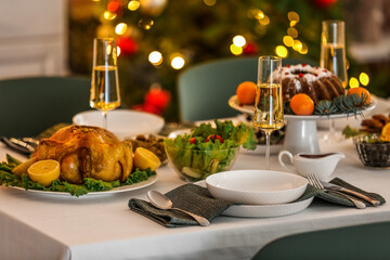Different tasty dishes for Christmas dinner on table