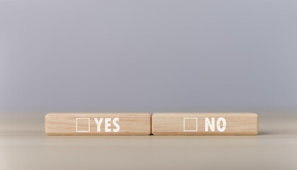 The wooden block shows yes or no letters.