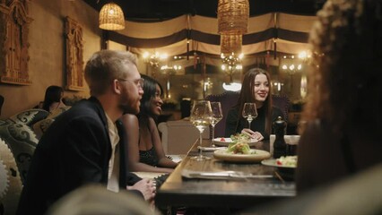 friends meeting in restaurant, multi ethnic people dining together, celebration anniversary