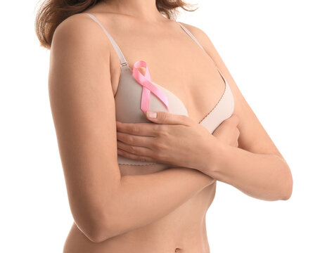 Woman in underwear with pink ribbon on white background. Breast cancer awareness concept