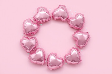 Frame made of heart-shaped balloons on pink background. Valentine's Day celebration
