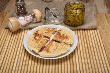 thin bread toast with sudjuk and cheese